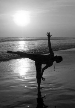 yoga pose on a beach at sunset performed by Katherine M. Sauer